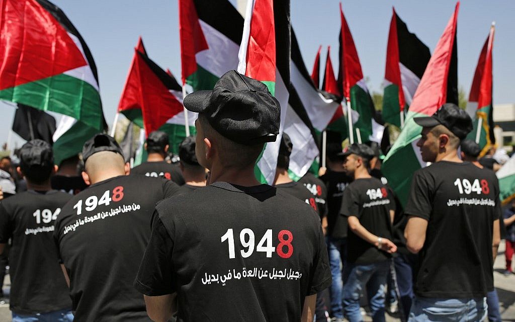 Palestinians hold up paper cutouts of keys as they take part in a rally marking the 71st anniversary of the 'Nakba', or catastrophe, on May 15, 2019 in Ramallah in the West Bank. (ABBAS MOMANI / AFP)