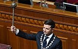 Ukraine's President Volodymyr Zelensky holds Bulava, the Ukrainian symbol of power, during his inauguration ceremony at the parliament in Kiev on May 20, 2019. (Genya Savilov/AFP)