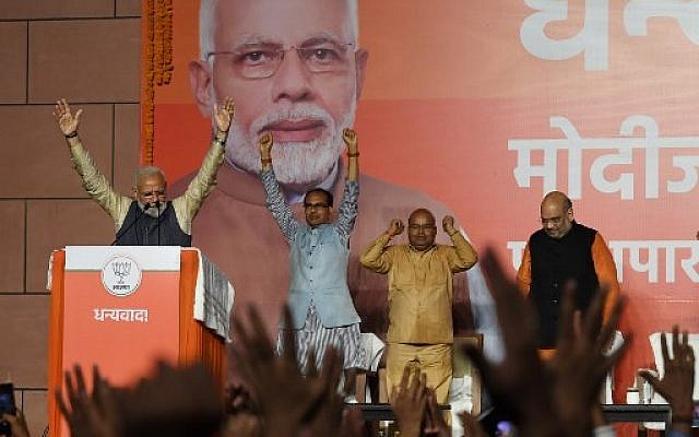 India Prime Minister Narendra Modi (L) gestures on stage during his victory speech at the Bharatiya Janta Party (BJP) headquaters after winning India's general election, in New Delhi on May 23, 2019. (Photo by PRAKASH SINGH / AFP) India Prime Minister Narendra Modi (L) gestures on stage during his victory speech at the Bharatiya Janta Party (BJP) headquaters after winning India's general election, in New Delhi on May 23, 2019. (Photo by PRAKASH SINGH / AFP)