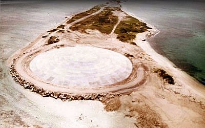 Picture taken by the US Defense Nuclear Agency in 1980, shows the huge dome built over top of a crater left by one of the 43 nuclear nuclear tests over Runit Island in Enewetak in the Marshall Islands. (GIFF JOHNSON / US DEFENCE NUCLEAR AGENCY / AFP)
