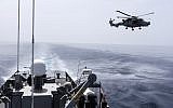 A picture taken from Cyprus' warship 'Ioannides' shows a Royal Navy Lynx helicopter taking part in the Multinational CIMIC Exercise, ARGONAUT 2019, Search and Rescue (SAR) Operations, a rescue drill in which the militaries of Cyprus, Greece, France, Britain, Israel, Germany and the US participated on May 30, 2019. (Iakovos Hatzistavrou/AFP)