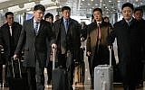 This file photo taken on February 19, 2019 shows a man believed to be North Korean negotiator Kim Hyok Chol (center L-blue tie) after arriving on an Air Koryo flight from Pyongyang, at Beijing international airport. (Ed JONES / AFP)