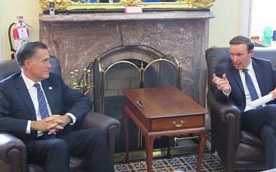 Sens. Mitt Romney, left, and Chris Murphy at the Capitol discuss their recent tour of the Middle East, April 30, 2019. (Ron Kampeas/JTA)