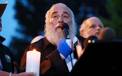 Rabbi Yisroel Goldstein speaks to community members and congregants about the shooting at the Chabad of Poway Synagogue during a candlelight vigil for the victim of the attack at Valle Verde Park in Poway, April 28, 2019. (Sandy Huffaker/AFP/Getty Images via JTA)