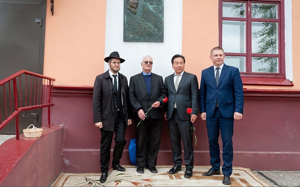 Nobuki Sugihara, second from right, with Chaim Chesler, in blue shirt, and guests of Limmud FSU Minsk at the village of Mir, Belarus, during an unveiling of a plaque for Chiune Sugihara, May 2, 2019. (Boris Brumin/via JTA) Nobuki Sugihara, second from right, with Chaim Chesler, in blue shirt, and guests of Limmud FSU Minsk at the village of Mir, Belarus, during an unveiling of a plaque for Chiune Sugihara, May 2, 2019. (Boris Brumin/via JTA)