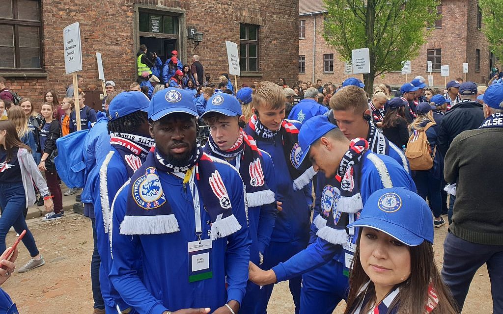 Players from the under-18 division of Britain’s Chelsea soccer club attend a March of the Living event in the former Auschwitz Nazi camp in Poland, May 2, 2019. (Cnaan Liphshiz/JTA) Players from the under-18 division of Britain’s Chelsea soccer club attend a March of the Living event in the former Auschwitz Nazi camp in Poland, May 2, 2019. (Cnaan Liphshiz/JTA)