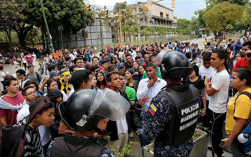 Students argue with police officers during a rally in support of opposition leader Juan Guaido and against Nicolas Maduro at Universidad Central de Venezuela in Caracas, Venezuela, May 2, 2019. (Edilzon Gamez/Getty Images/via JTA) Students argue with police officers during a rally in support of opposition leader Juan Guaido and against Nicolas Maduro at Universidad Central de Venezuela in Caracas, Venezuela, May 2, 2019. (Edilzon Gamez/Getty Images/via JTA)