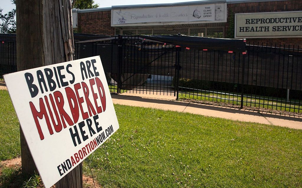 An anti-abortion sign is placed outside of the Reproductive Health Services building in Montgomery, Alabama, on May 20, 2019. (Seth HERALD / AFP/Getty Images) An anti-abortion sign is placed outside of the Reproductive Health Services building in Montgomery, Alabama, on May 20, 2019. (Seth HERALD / AFP/Getty Images)