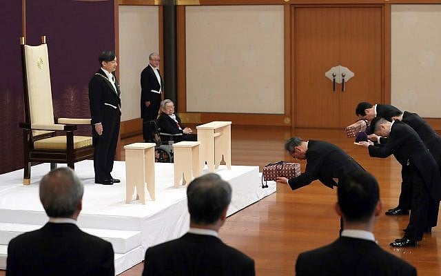 Japan's new Emperor Naruhito receives the Imperial regalia of sword and jewel as proof of succession at the ceremony at Imperial Palace in Tokyo, Wednesday, May 1, 2019. (Japan Pool via AP) Japan's new Emperor Naruhito receives the Imperial regalia of sword and jewel as proof of succession at the ceremony at Imperial Palace in Tokyo, Wednesday, May 1, 2019. (Japan Pool via AP)