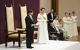 Japan's new Emperor Naruhito, accompanied by new Empress Masako, makes his first address during a ritual after succeeding his father Akihito at Imperial Palace in Tokyo, May 1, 2019. (Japan Pool via AP)