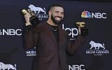 Drake poses with his awards at the Billboard Music Awards on May 1, 2019, at the MGM Grand Garden Arena in Las Vegas. (Richard Shotwell/Invision/AP)