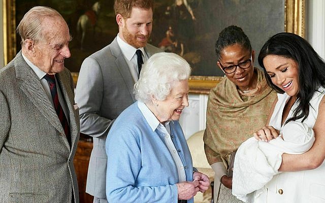 In this image made available by SussexRoyal on Wednesday May 8, 2019, Britain's Prince Harry and Meghan, Duchess of Sussex, joined by her mother Doria Ragland, show their new son to Queen Elizabeth II and Prince Philip at Windsor Castle, Windsor, England. (Chris Allerton/SussexRoyal via AP) In this image made available by SussexRoyal on Wednesday May 8, 2019, Britain's Prince Harry and Meghan, Duchess of Sussex, joined by her mother Doria Ragland, show their new son to Queen Elizabeth II and Prince Philip at Windsor Castle, Windsor, England. (Chris Allerton/SussexRoyal via AP)