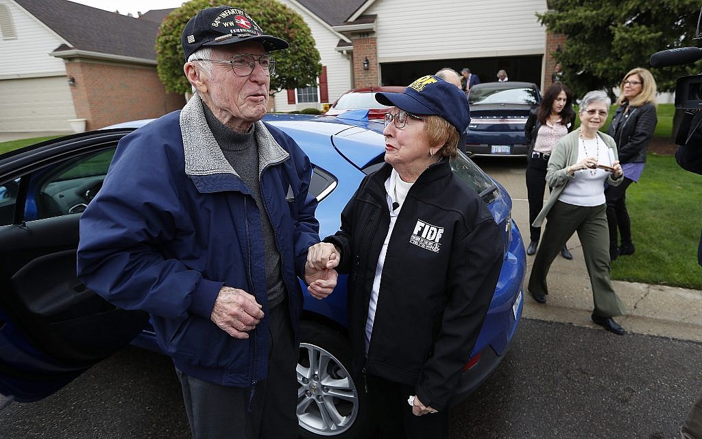 Doug Harvey, 95, and Holocaust survivor Sophie Tajch Klisman, 89, right, greet each other in Commerce Township, Michigan, May 13, 2019. (AP Photo/Paul Sancya) Doug Harvey, 95, and Holocaust survivor Sophie Tajch Klisman, 89, right, greet each other in Commerce Township, Michigan, May 13, 2019. (AP Photo/Paul Sancya)