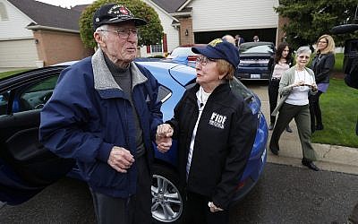 Doug Harvey, 95, and Holocaust survivor Sophie Tajch Klisman, 89, right, greet each other in Commerce Township, Michigan, May 13, 2019. (AP Photo/Paul Sancya)