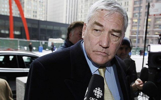 In this Jan. 13, 2011 file photo, Conrad Black arrives at the federal building in Chicago. President Donald Trump has granted a full pardon to Black, a former newspaper publisher who has written a flattering political biography of Trump. Black's media empire once included the Chicago Sun-Times and The Daily Telegraph of London. (AP Photo/Charles Rex Arbogast) In this Jan. 13, 2011 file photo, Conrad Black arrives at the federal building in Chicago. President Donald Trump has granted a full pardon to Black, a former newspaper publisher who has written a flattering political biography of Trump. Black's media empire once included the Chicago Sun-Times and The Daily Telegraph of London. (AP Photo/Charles Rex Arbogast)