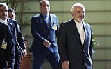 Iranian Foreign Minister Mohammad Javad Zarif, right, walks to meet Japanese Prime Minister Shinzo Abe at Abe's official residence in Tokyo, May 16, 2019. (Eugene Hoshiko/Pool/AP)