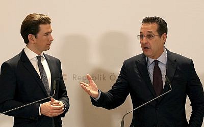 In this December 4, 2018 file photo, Austria's Chancellor Sebastian Kurz and Austrian Vice Chancellor Heinz-Christian Strache, from left, hold a joint press conference after one year government in Austria at the Hofburg palace in Vienna, Austria. (AP Photo/Ronald Zak)
