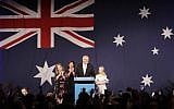 Australian Prime Minister Scott Morrison, second right, arrives on stage to speak to party supporters flanked by his wife, Jenny, and daughters Lily, and Abbey, left, after his opponent concedes defeat in the federal election in Sydney, Australia, Sunday, May 19, 2019. (AP Photo/Rick Rycroft)