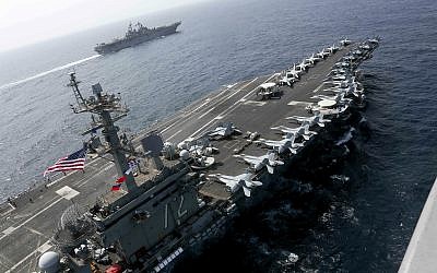 In this May 17, 2019, photo released by the US Navy, the USS Abraham Lincoln sails in the Arabian Sea near the amphibious assault ship USS Kearsarge. (Mass Communication Specialist 1st Class Brian M. Wilbur, US Navy via AP)