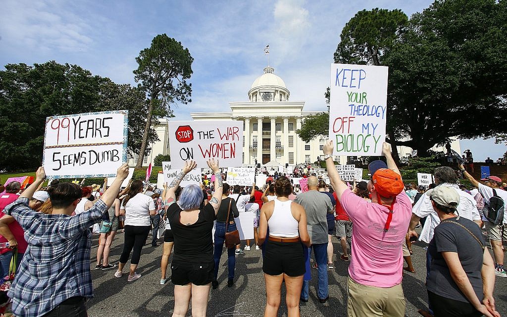 Protesters for women's rights hold a rally on the Alabama Capitol steps to protest a law passed last week making abortion a felony in nearly all cases with no exceptions for cases of rape or incest, Sunday, May 19, 2019, in Montgomery, Ala. (AP Photo/Butch Dill) Protesters for women's rights hold a rally on the Alabama Capitol steps to protest a law passed last week making abortion a felony in nearly all cases with no exceptions for cases of rape or incest, Sunday, May 19, 2019, in Montgomery, Ala. (AP Photo/Butch Dill)