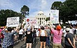Protesters for women's rights hold a rally on the Alabama Capitol steps to protest a law passed last week making abortion a felony in nearly all cases with no exceptions for cases of rape or incest, Sunday, May 19, 2019, in Montgomery, Ala. (AP Photo/Butch Dill)