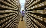 Illustrative: a Jewish genealogist from New Jersey takes a look at name registers at the International Tracing Service in Bad Arolsen, central Germany, May 8, 200. (Michael Probst/AP)