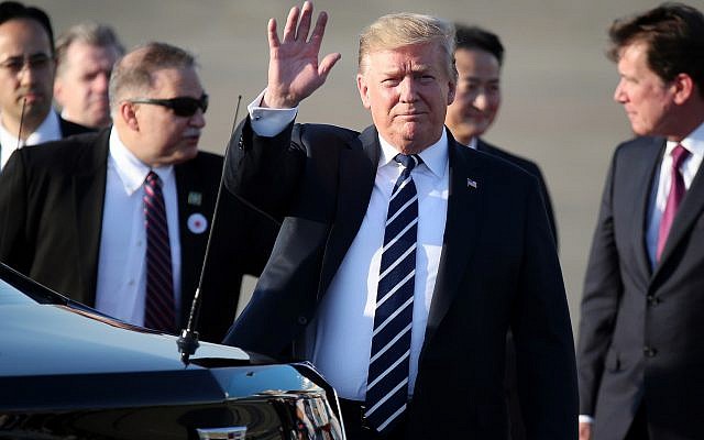 US President Donald Trump waves as he arrives at the Haneda International Airport on May 25, 2019, in Tokyo. (AP Photo/Koji Sasahara, Pool) US President Donald Trump waves as he arrives at the Haneda International Airport on May 25, 2019, in Tokyo. (AP Photo/Koji Sasahara, Pool)