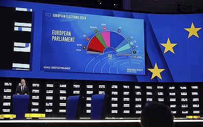 A projection of the composition of the next European Parliament on a large screen in the press room at the European Parliament in Brussels on May 27, 2019. (AP Photo/Olivier Matthys)