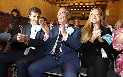 Brexit Party leader Nigel Farage reacts as results are announced at the counting center for the European Elections for the South East England region, in Southampton, England on May 26, 2019. (AP Photo/Alastair Grant)