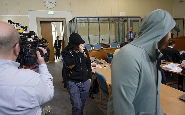 In this May 24, 2019 file photo, two defendants of a self-styled 'Sharia police' arrive in a courtroom in Wuppertal, Germany. (Henning Kaiser/dpa via AP) In this May 24, 2019 file photo, two defendants of a self-styled 'Sharia police' arrive in a courtroom in Wuppertal, Germany. (Henning Kaiser/dpa via AP)