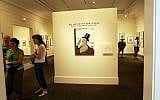 Illustrative: Visitors look around an exhibit of cover art from the New Yorker Magazine at Norman Rockwell Museum in Stockbridge, Massachusetts, July 22, 2005. (AP Photo/Chitose Suzuki)