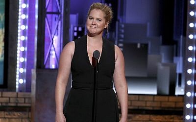 In this file photo from June 10, 2018, Amy Schumer introduces a performance by the cast of "My Fair Lady" at the 72nd annual Tony Awards at Radio City Music Hall in New York. (Photo by Michael Zorn/Invision/AP, File)
