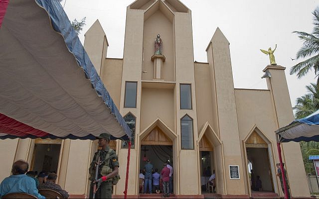 A soldier stands guard during a Catholic Mass outside St. Joseph's church in Thannamunai, Sri Lanka, April 30, 2019. (AP/Gemunu Amarasinghe) A soldier stands guard during a Catholic Mass outside St. Joseph's church in Thannamunai, Sri Lanka, April 30, 2019. (AP/Gemunu Amarasinghe)