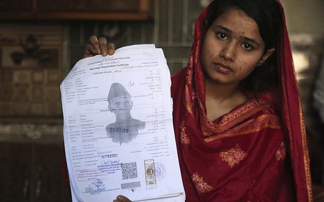 Mahek Liaqat, a Pakistani Christian girl lured into a marriage with a Chinese national, shows her marriage certificate in Gujranwala, Pakistan, April 14, 2019. (AP/K.M. Chaudary) Mahek Liaqat, a Pakistani Christian girl lured into a marriage with a Chinese national, shows her marriage certificate in Gujranwala, Pakistan, April 14, 2019. (AP/K.M. Chaudary)