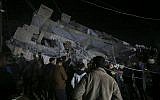 Residents inspect the damage to a building in Gaza City, May 4, 2019. (AP/Adel Hana)