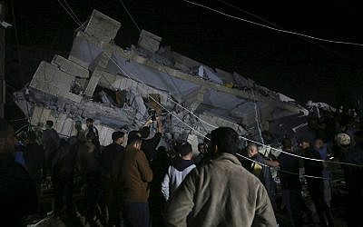 Residents inspect the damage to a building in Gaza City, May 4, 2019. (AP/Adel Hana)