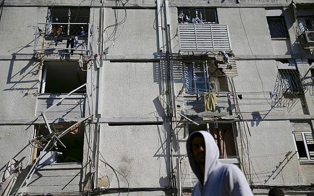Damage is seen in a residential area after it was hit a by a rocket fired from Gaza in the southern Israeli city of Ashkelon,, May 5, 2019. (AP/Ariel Schalit) Damage is seen in a residential area after it was hit a by a rocket fired from Gaza in the southern Israeli city of Ashkelon,, May 5, 2019. (AP/Ariel Schalit)