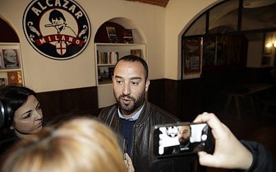 Francesco Polacchi, regional coordinator of Casapound far-right political party, and founder of Altaforte publishing company, answers to reporters during a news conference, in Milan, Italy, Wednesday, May 8, 2019.  (AP Photo/Luca Bruno)