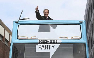 Brexit Party leader Nigel Farage gestures on an open topped bus while on the European Election campaign trail in Sunderland, England, Saturday, May 11, 2019. (Danny Lawson/PA via AP)