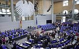 Lawmakers attend a polling at the German federal parliament, Bundestag, at the Reichstag building in Berlin, Germany, Friday, May 17, 2019. German lawmakers have approved a resolution denouncing the Boycott, Divest and Sanctions movement against Israel and describing its methods as anti-Semitic. (Wolfgang Kumm/dpa via AP)