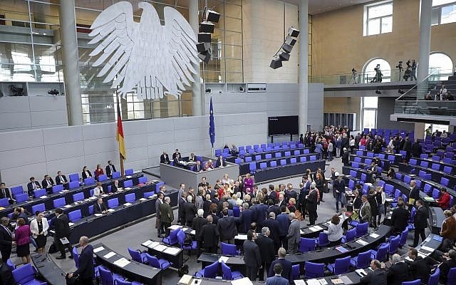 Lawmakers attend a polling at the German federal parliament, Bundestag, at the Reichstag building in Berlin, Germany, Friday, May 17, 2019. German lawmakers have approved a resolution denouncing the Boycott, Divest and Sanctions movement against Israel and describing its methods as anti-Semitic. (Wolfgang Kumm/dpa via AP) Lawmakers attend a polling at the German federal parliament, Bundestag, at the Reichstag building in Berlin, Germany, Friday, May 17, 2019. German lawmakers have approved a resolution denouncing the Boycott, Divest and Sanctions movement against Israel and describing its methods as anti-Semitic. (Wolfgang Kumm/dpa via AP)