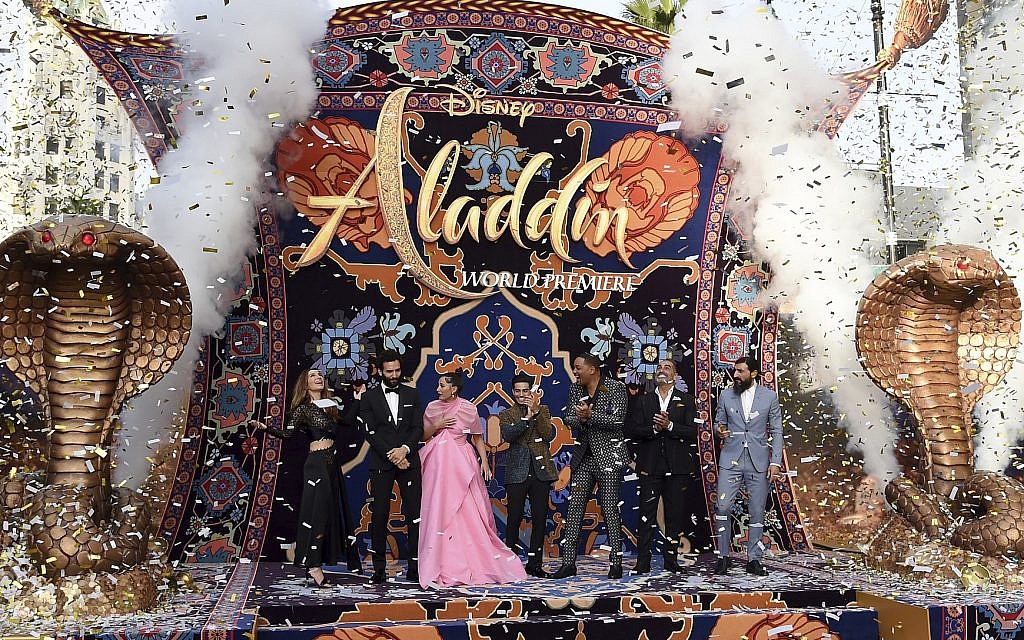 Nasim Pedrad, from left, Marwan Kenzari, Naomi Scott, Mena Massoud, Will Smith, Navid Negahban and Numan Acar react as confetti falls at the premiere of "Aladdin" on May 21, 2019, at the El Capitan Theatre in Los Angeles. (Photo by Chris Pizzello/Invision/AP) Nasim Pedrad, from left, Marwan Kenzari, Naomi Scott, Mena Massoud, Will Smith, Navid Negahban and Numan Acar react as confetti falls at the premiere of "Aladdin" on May 21, 2019, at the El Capitan Theatre in Los Angeles. (Photo by Chris Pizzello/Invision/AP)