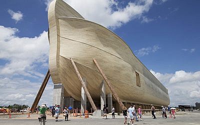 In this July 5, 2016, file photo, visitors pass outside the front of a replica Noah's Ark at the Ark Encounter theme park during a media preview day, in Williamstown, Kentucky. (AP Photo/John Minchillo, File)