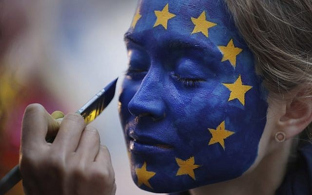 A woman has her face painted as the EU flag outside the European Parliament in Brussels, May 26, 2019, as voters from 21 nations voted on the final day of European Parliament elections. (AP /Francisco Seco) A woman has her face painted as the EU flag outside the European Parliament in Brussels, May 26, 2019, as voters from 21 nations voted on the final day of European Parliament elections. (AP /Francisco Seco)