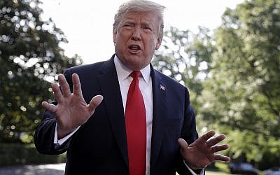US President Donald Trump talks with reporters before departing on Marine One for the Air Force Academy graduation ceremony, May 30, 2019, in Washington. (AP Photo/Evan Vucci)