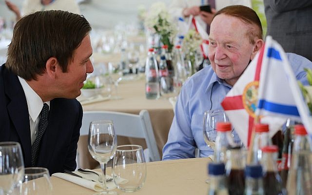 Florida Governor Ron DeSantis (L) talks to Republican donor Sheldon Adelson at a ceremony at Ariel University in the West Bank on May 27, 2019 where he was presented with the Honorary Fellowship Award for his dedication, leadership and commitment to the State of Israel (Courtesy/Governor’s Press Office) Florida Governor Ron DeSantis (L) talks to Republican donor Sheldon Adelson at a ceremony at Ariel University in the West Bank on May 27, 2019 where he was presented with the Honorary Fellowship Award for his dedication, leadership and commitment to the State of Israel (Courtesy/Governor’s Press Office)
