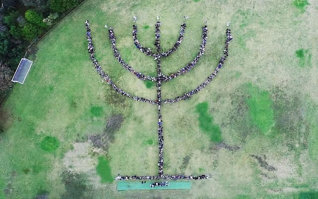 The largest human menorah, ever, seen in Melbourne, Australia. (Courtesy of Bialik College via JTA) The largest human menorah, ever, seen in Melbourne, Australia. (Courtesy of Bialik College via JTA)
