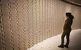 An Israeli soldier at a Memorial Day ceremony at the Mount Herzl military cemetery in Jerusalem on Memorial Day, which commemorates Israel's fallen soldiers and Israeli civilians killed in terror attacks, April 18, 2018. (Marc Israel Sellem/POOL)