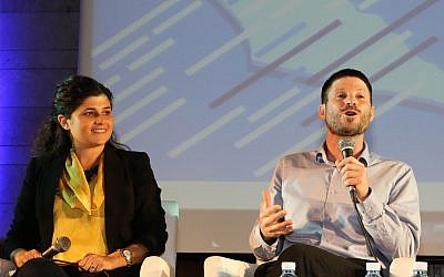 Likud MK Sharren Haskel (L) and Jewish Home MK Bezalel Smotrich speak at a conference in Jerusalem on May 27, 2018. (Gershon Elinson/ Flash90)