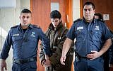 Arafat Irfaiya, charged with the rape and murder of 19-year-old Ori Ansbacher is brought for a hearing at the Jerusalem District court, on March 7, 2019. (Yonatan Sindel/Flash90)